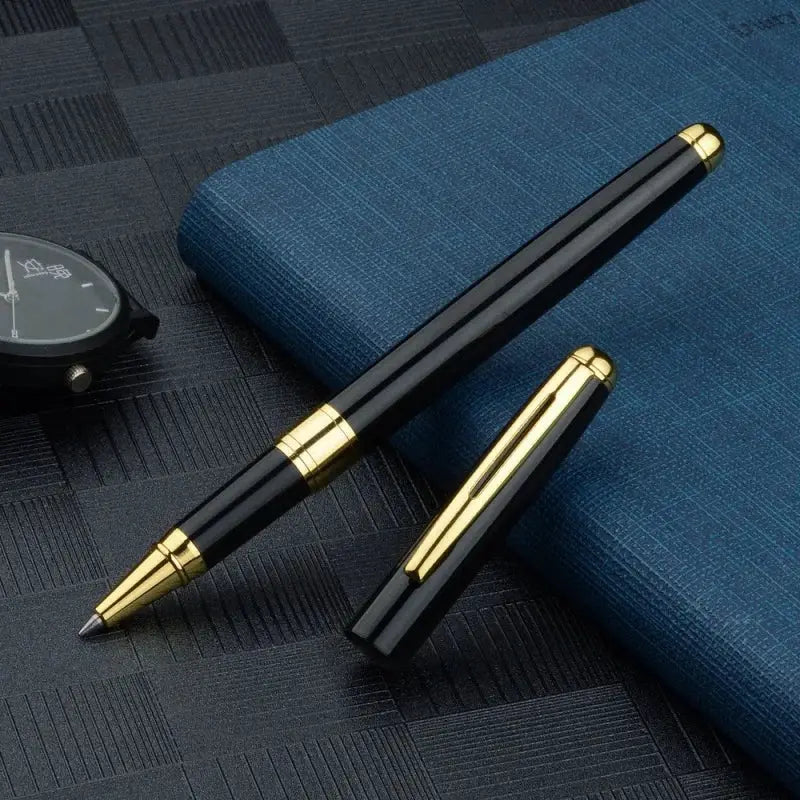Simples Market ballpoint pen, black body with gold cap and clip, refillable stainless steel signature pen