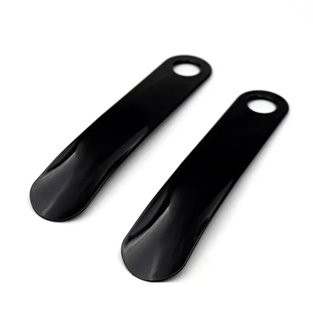 Shoe horns, black plastic, spoon-shaped ends with hanging holes, two-piece set