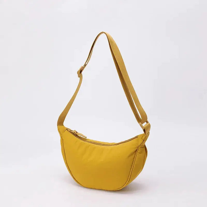 Nylon crescent crossbody bag by Simples Market in yellow