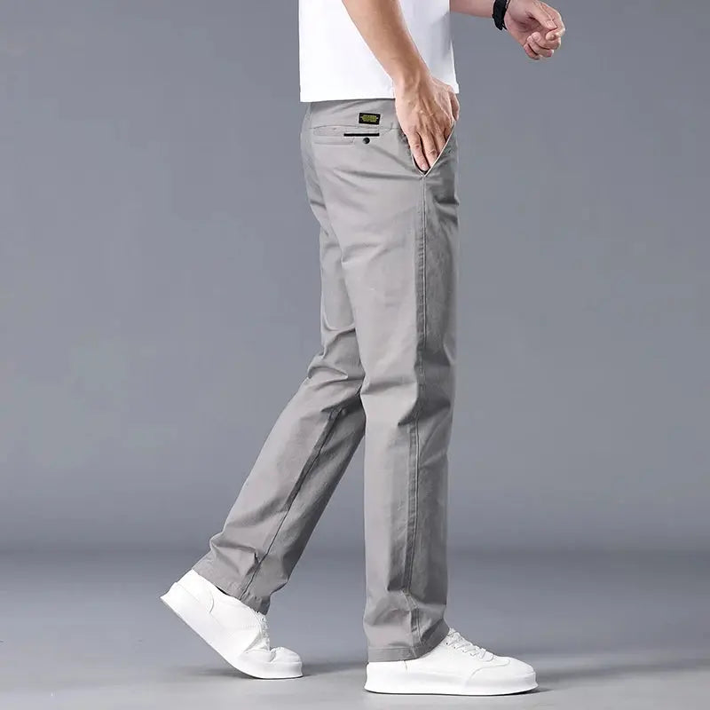 Men's straight-fit stretch chinos in light khaki by Simples Market with back pocket detail.