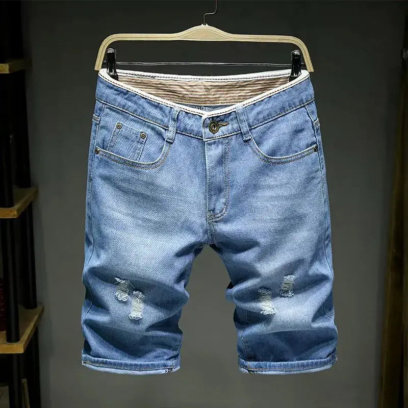 Men's light blue denim shorts with distressed knees; slim fit, belt loops