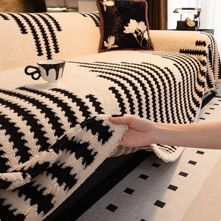 Simples Market thick warm jacquard fleece sofa throw blanket in black and cream on a beige sofa