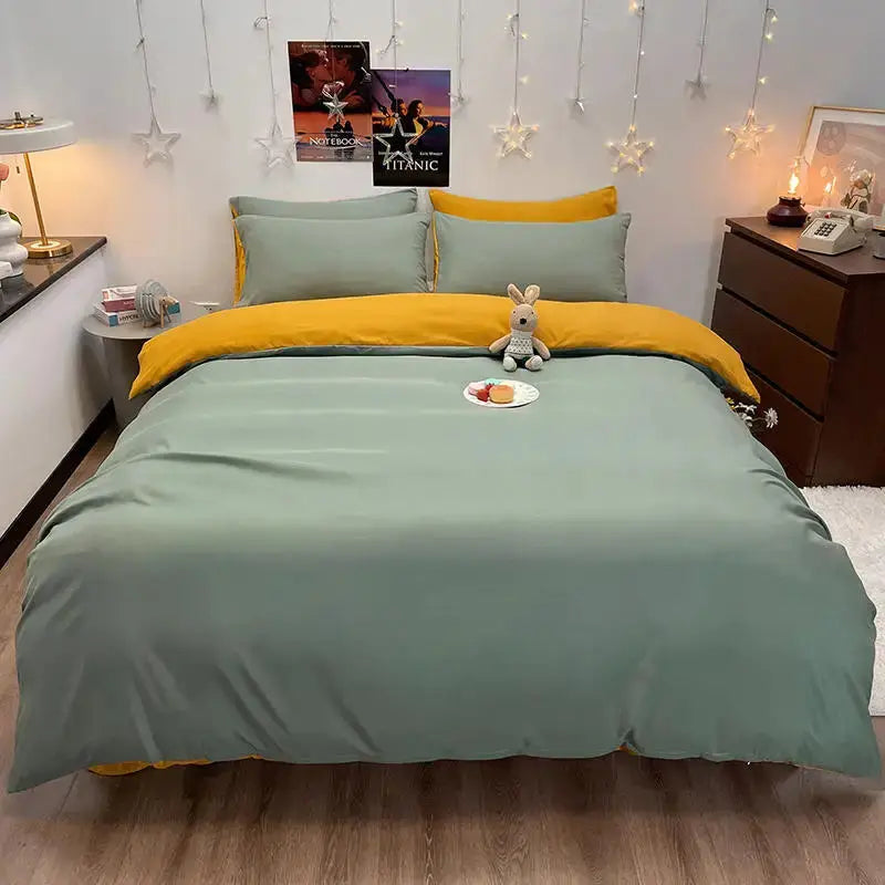 Duvet cover set on a queen/king bed in dark gray with two teal pillowcases and a mustard accent throw.