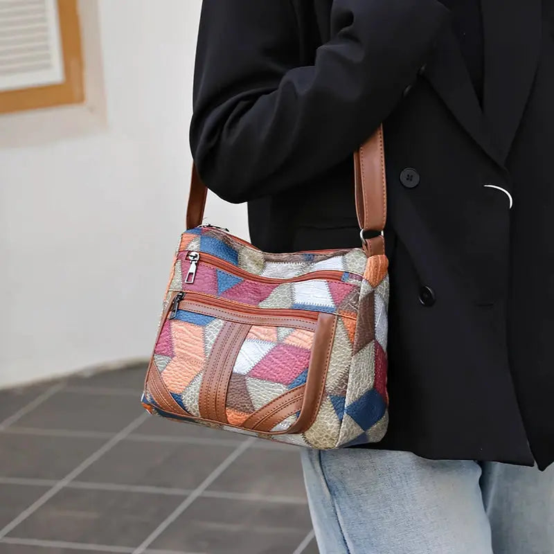Women's crossbody bag with colorful geometric patchwork and brown leather trim by Simples Market