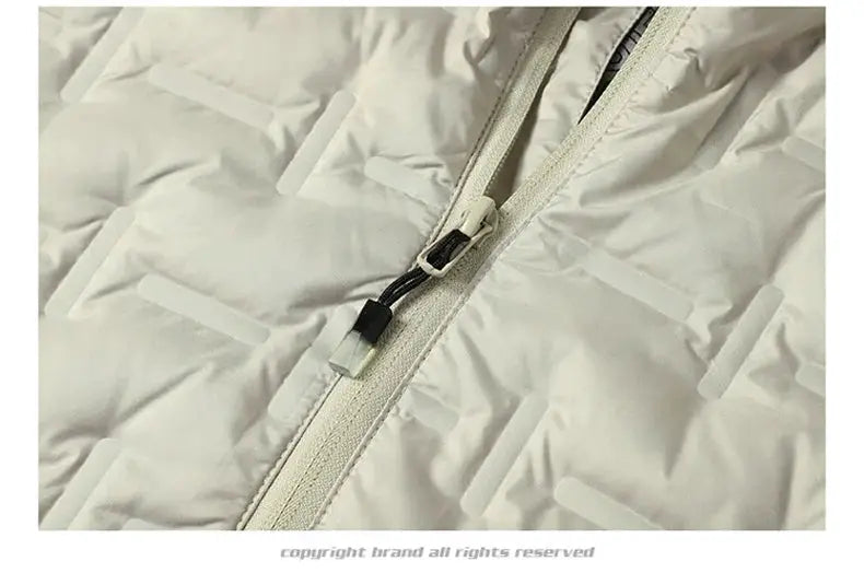 Winter white men's down jacket zipper close-up; quilted puffer fabric with a light-colored zipper pull