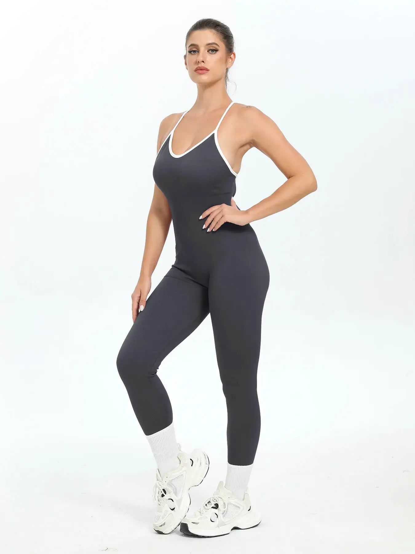Women’s ribbed seamless jumpsuit in dark grey with white trim and thin straps