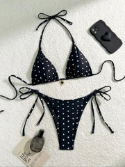 Bikini set two-piece, black with white polka dots, halter top and tie-side bottoms