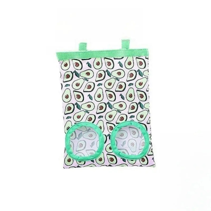 Simples Market Rabbit Hay Bag hanging small-animal feeder with two green-ringed feeding windows, avocado-pattern fabric.