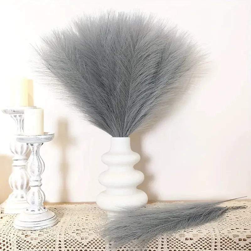 Artificial pampas grass bouquet in gray fluffy plumes with white vase for boho decor