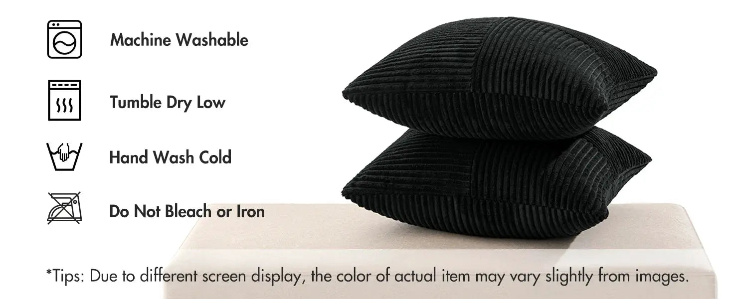 2 black corduroy decorative throw pillows with ribbed patchwork texture