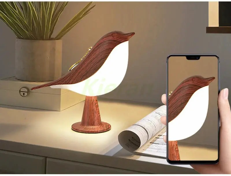 Magpie LED desk lamp with wooden base and white wing-shaped shade, Nordic modern style.