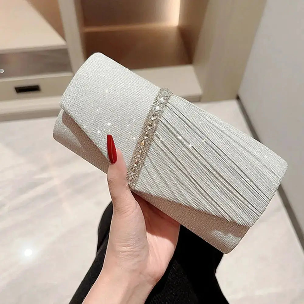 Champagne sequined evening clutch with crystal-embellished band