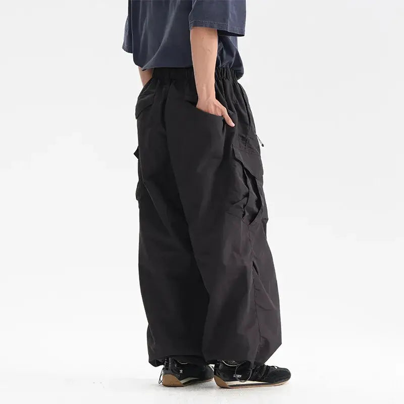 Ultra Loose Lightweight Outdoor Functional Pants by Simples Market, black cargo pockets, wide-leg, waterproof quick-dry.