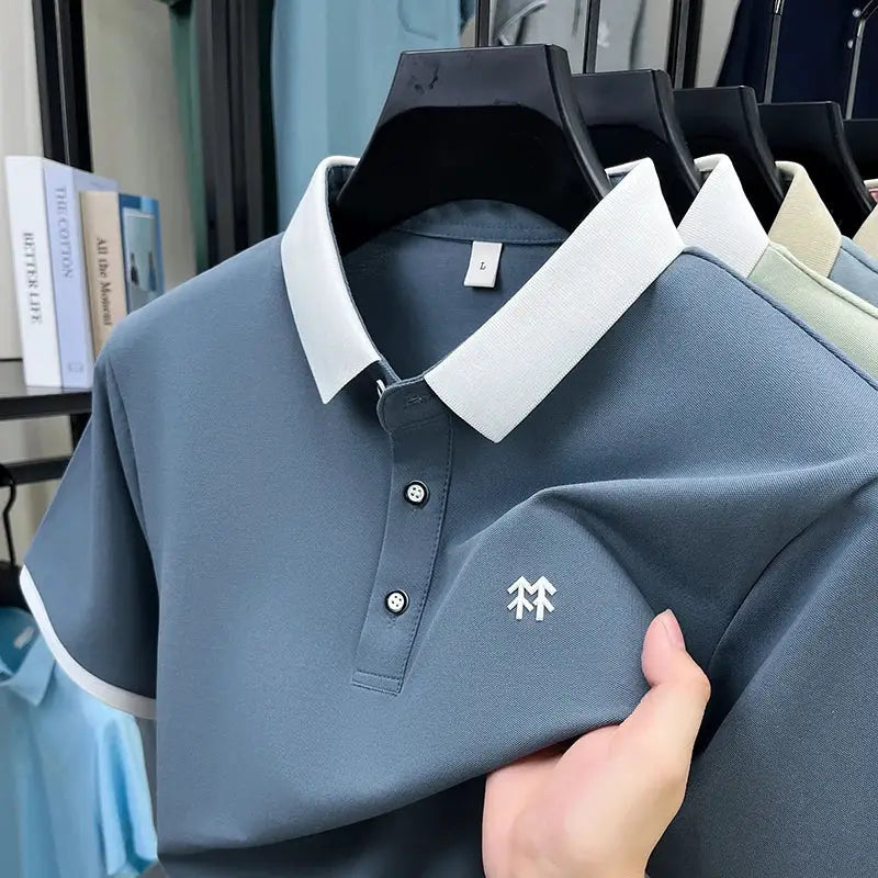 Polo shirt, blue-gray silk-cotton with white collar trim and chest logo