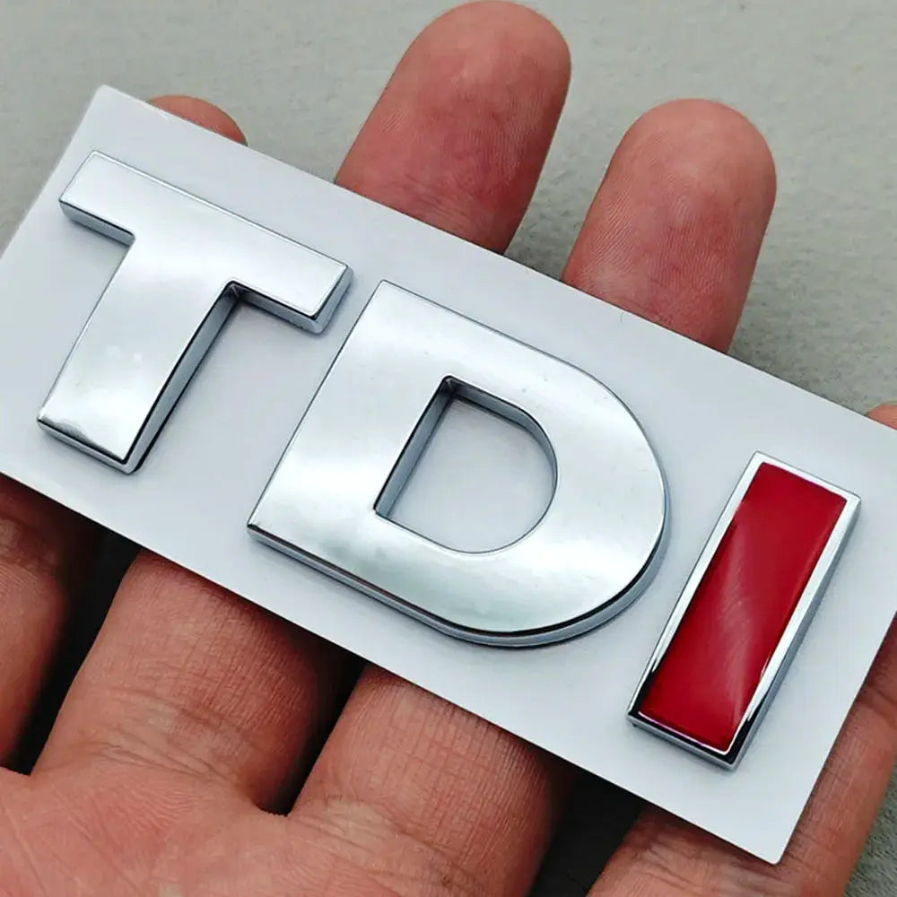 TDI chrome car emblem badge with red inset on white backing plate