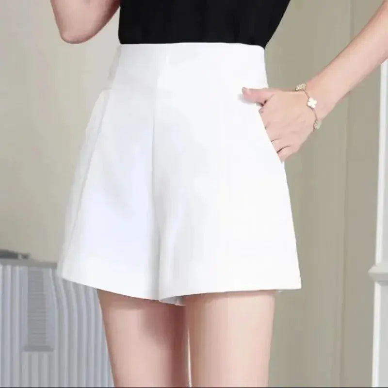 Women's white high-waist A-line shorts with a loose wide-leg silhouette