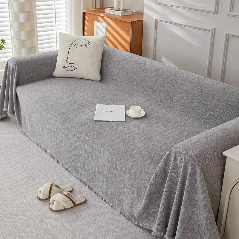 Couch cover Simples Market in grey chenille with fringe and herringbone texture