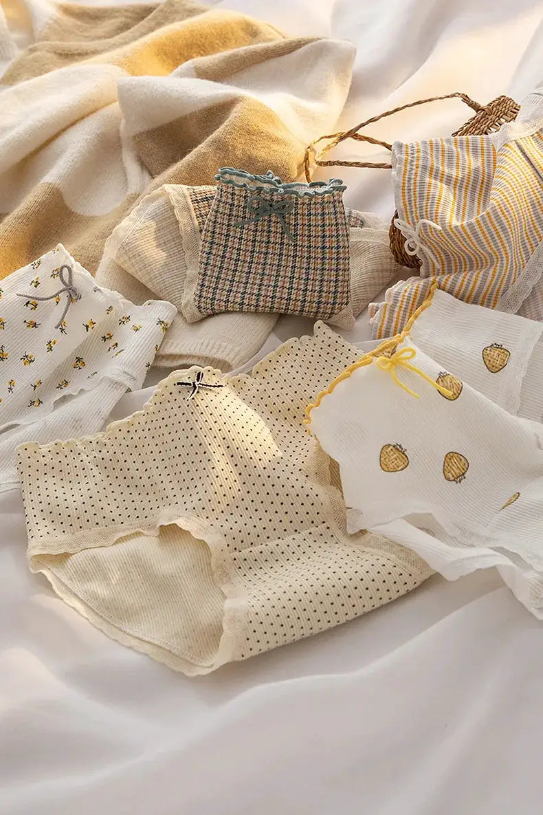 Simples Market M-XL women's cotton mid-waist briefs; cream with floral, dots, and pineapple prints, lace trim.