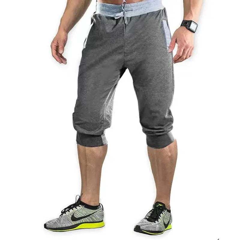 Men's athletic capri joggers in gray with light blue waistband and elastic cuffs