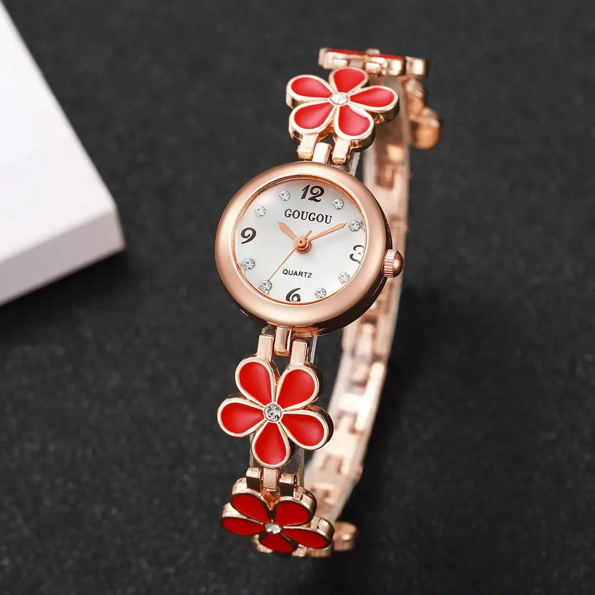 GOUGOU quartz women's wristwatch with rose-gold bracelet and two red flower charms, white dial with crystal markers