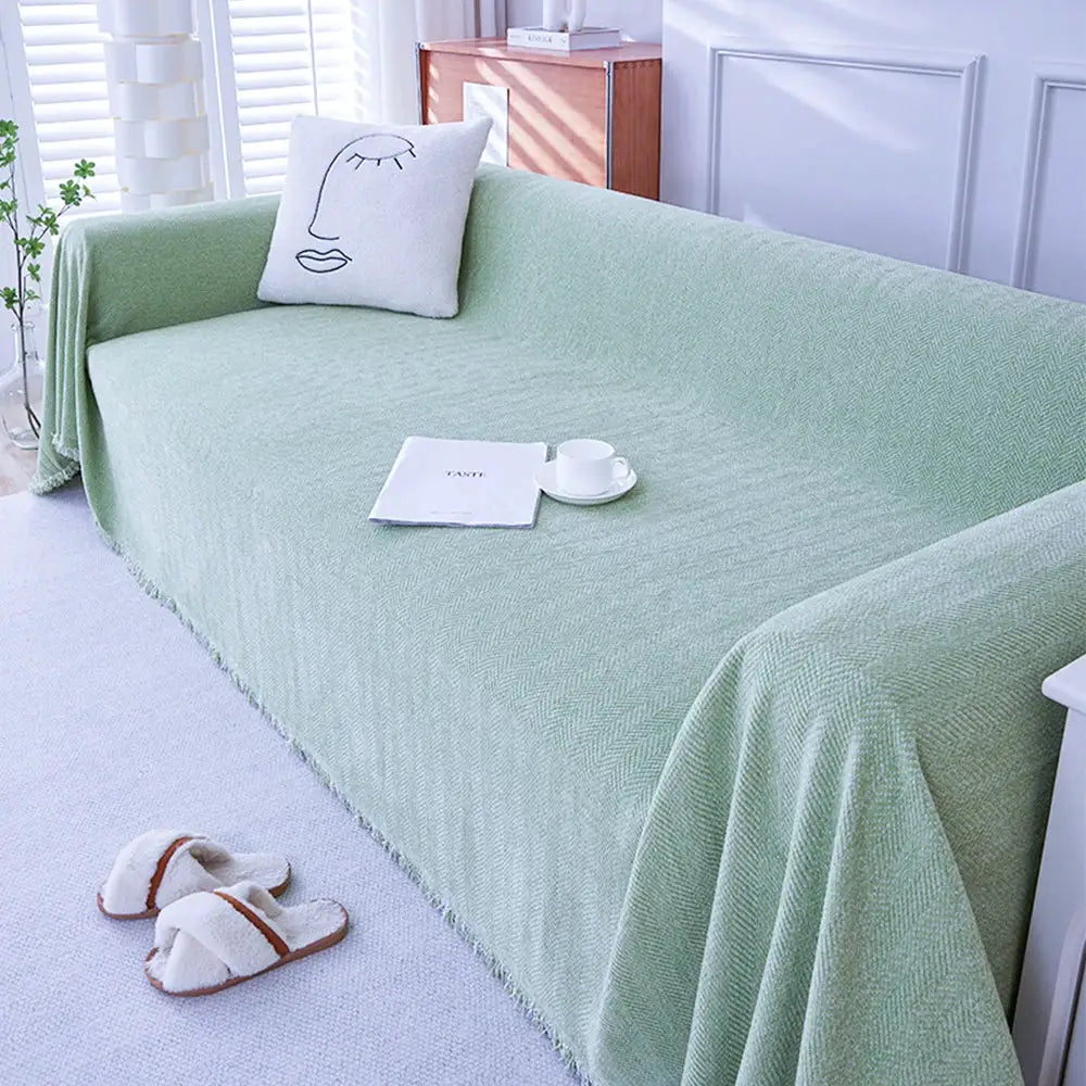 Simples Market couch cover in sage green chenille with fringe and herringbone texture