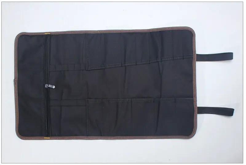 Multifunction roller tool bag, black Oxford canvas with brown trim, opened to show multiple pockets and a zipper pocket