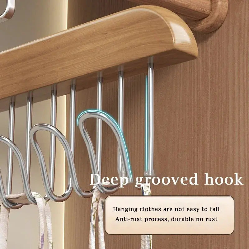 Bra hanger organizer with deep grooved chrome hooks on a wooden wardrobe rail