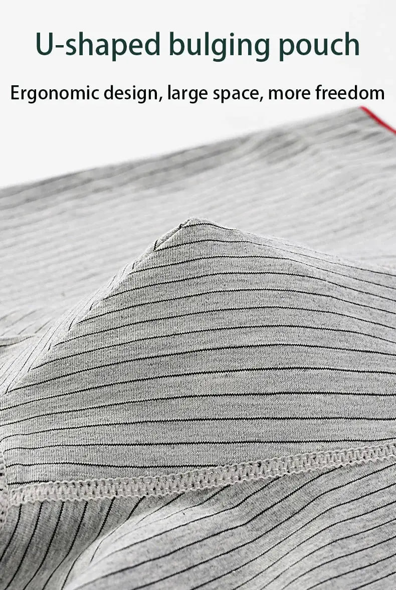 Gray striped men's boxer underwear fabric close-up with soft knit and visible seam.