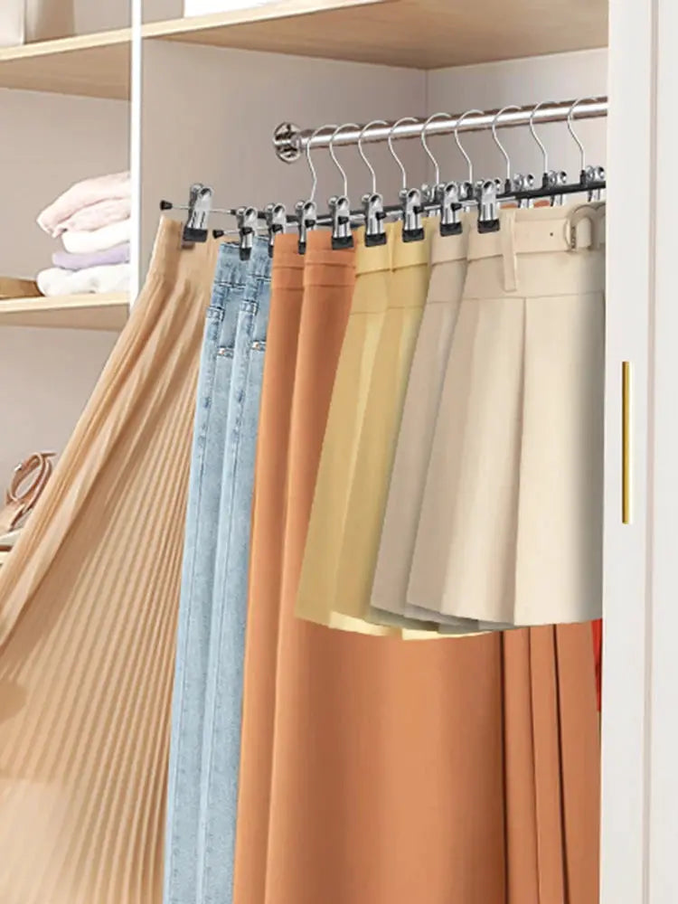 Wardrobe drying rack with stainless steel clips for skirts and pants, hanging in a closet