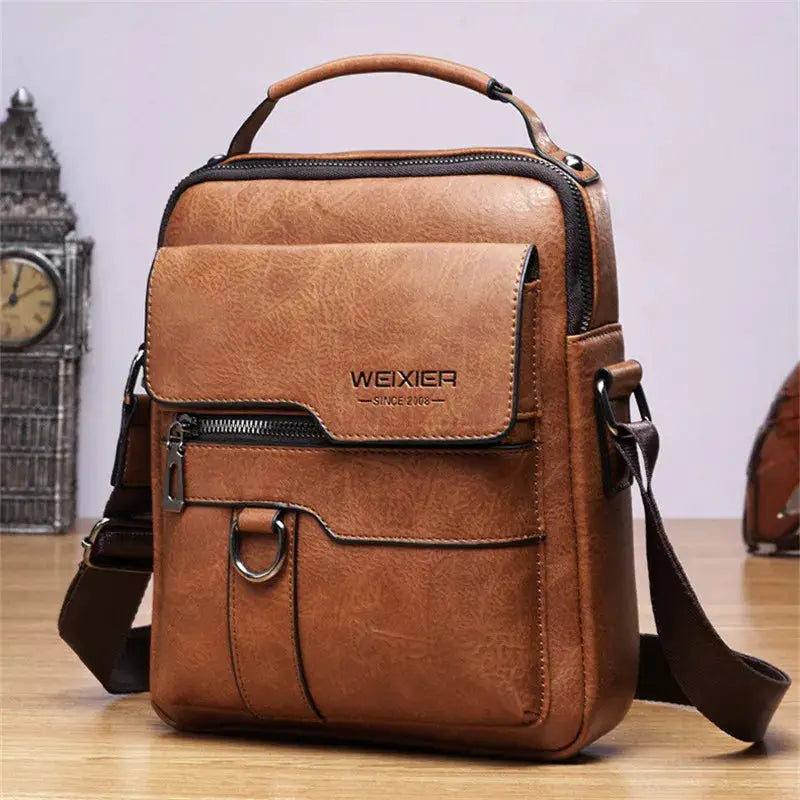 Men's brown leather shoulder bag with front zip pocket, D-ring, and WEIXIER branding