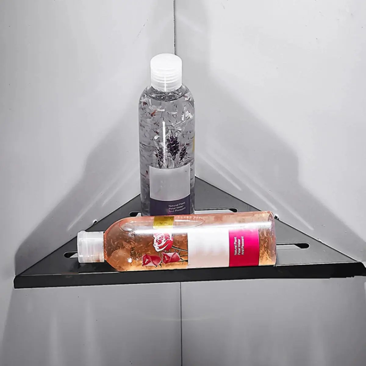 Corner shower shelf by Simples Market, black stainless steel, no-drill install, holds two bottles