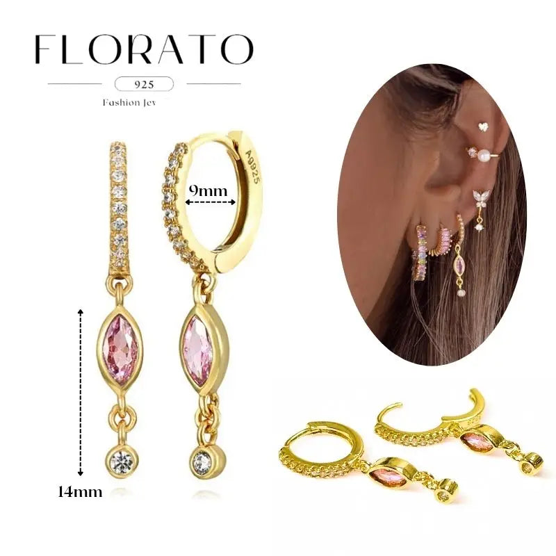 Gold-tone 925 sterling silver earrings set with pink zircon pendants by Simples Market