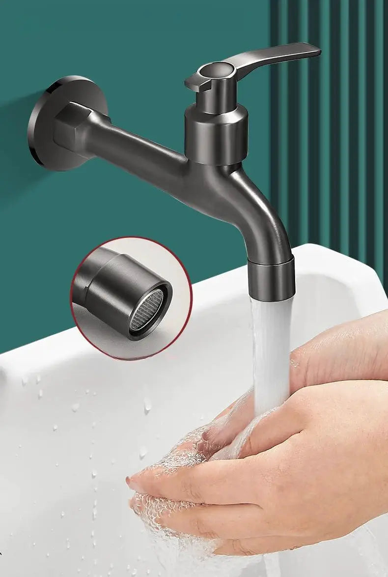 Copper wall-mounted basin faucet with single lever and built-in mesh filter; water flows into sink.