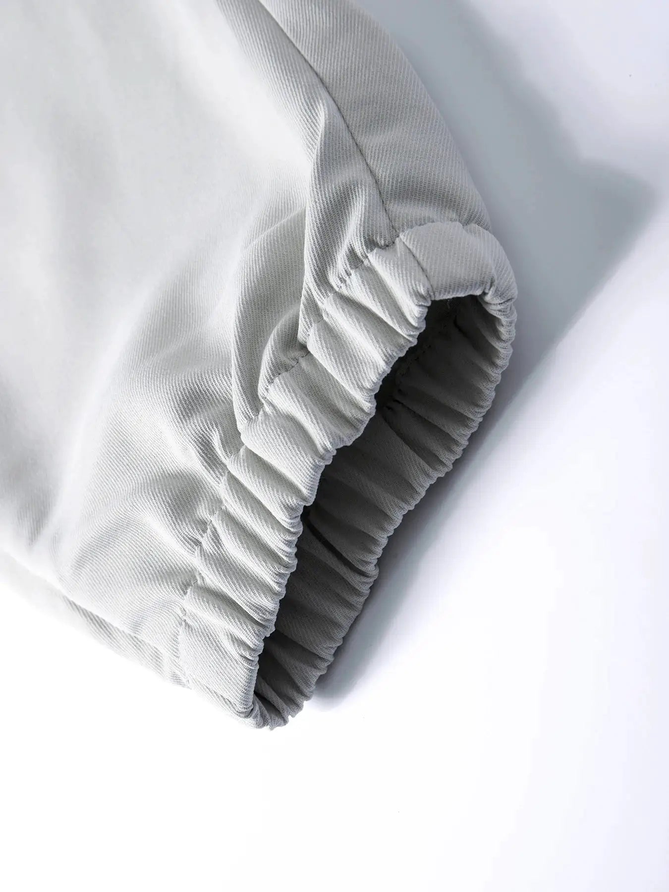 Light gray men's cargo jogger pants with elastic ankle cuffs