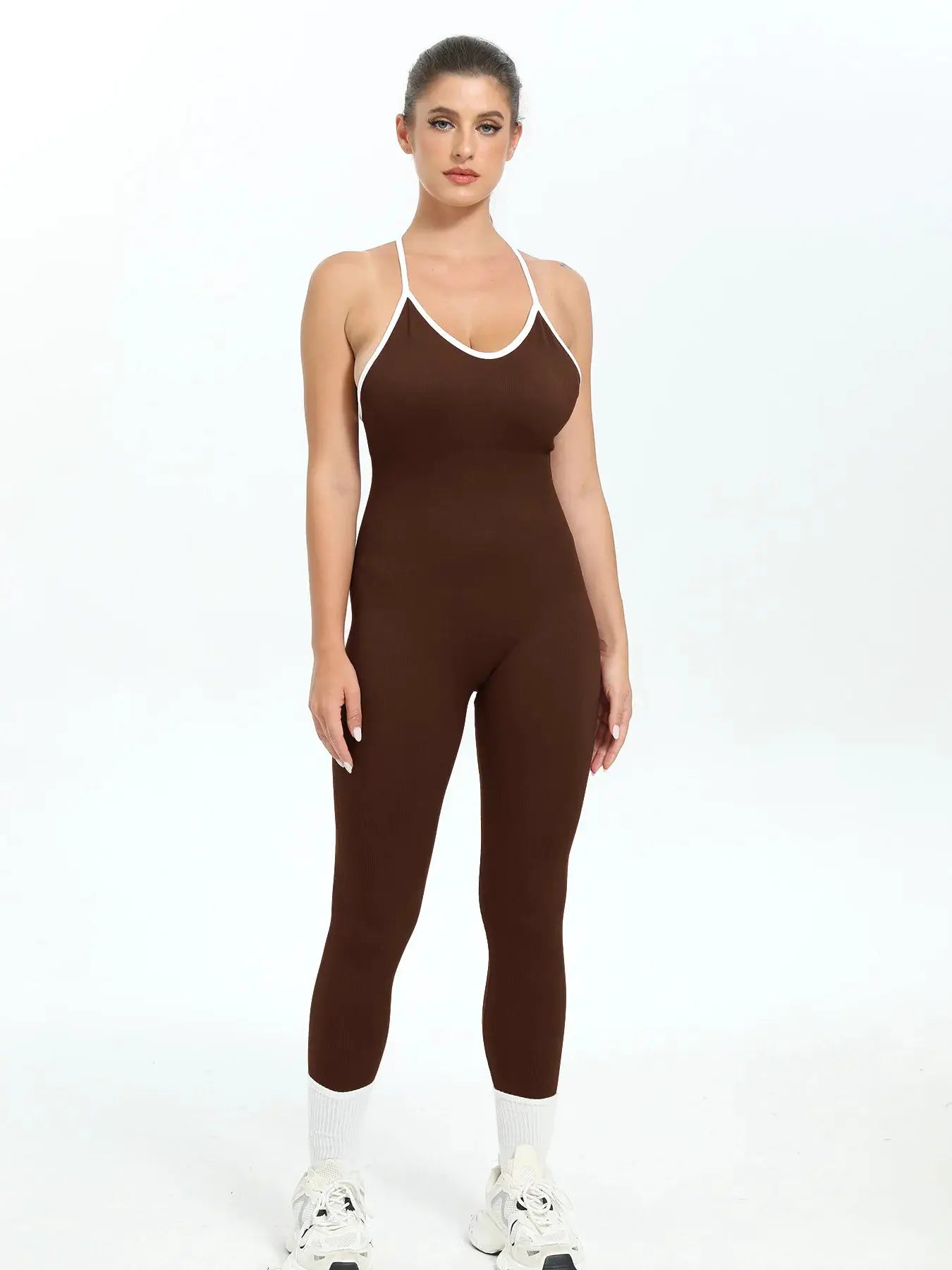 Women’s brown ribbed seamless jumpsuit with white trim; sleeveless, slim-fit gym bodysuit with ankle-length leggings.