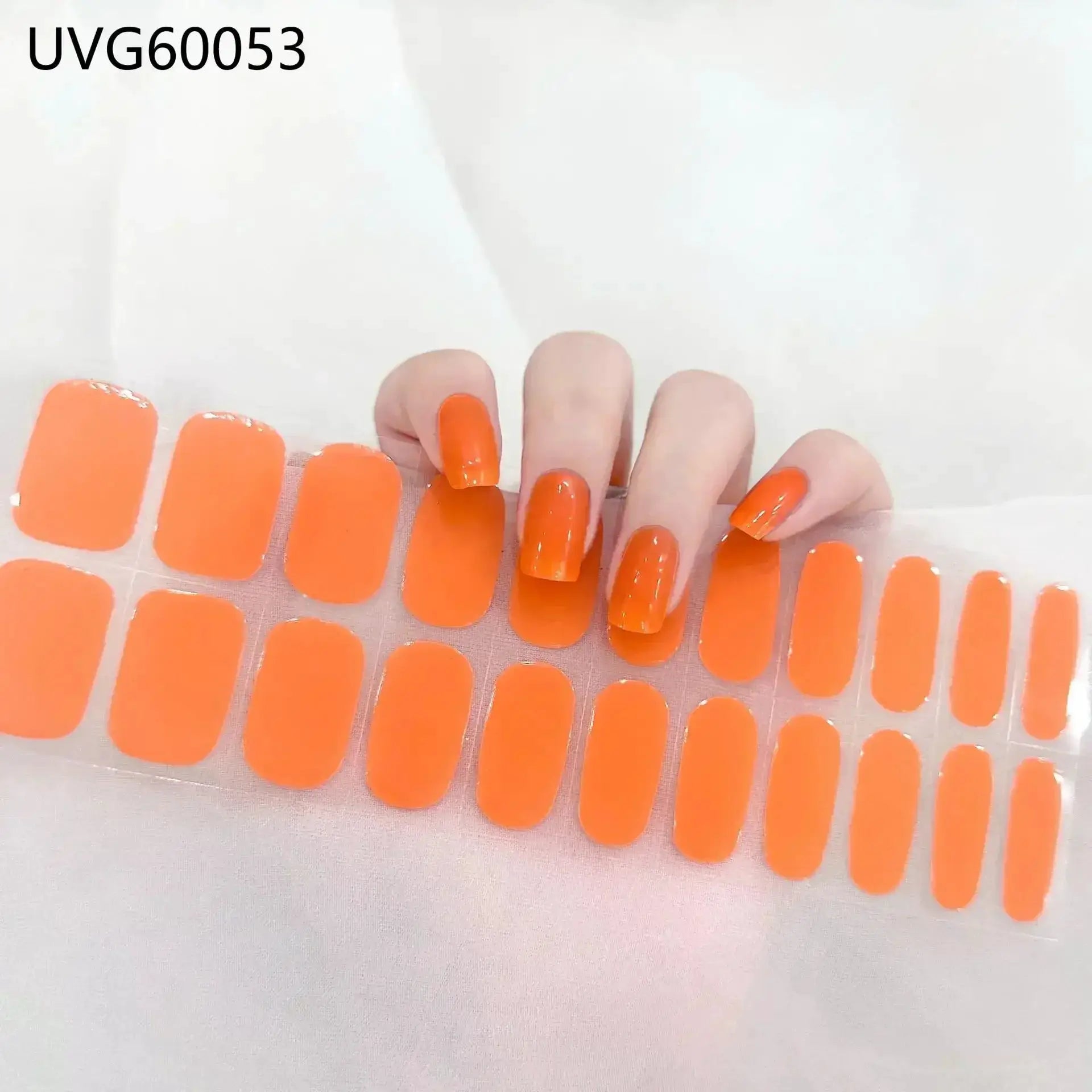 Simples Market gel nail wrap set in bright orange; full-cover tips on a swatch sheet UVG60053