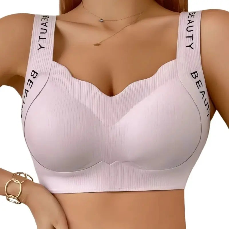 Ribbed wireless push-up bra in light pink, seamless plus-size with wide straps and wave neckline