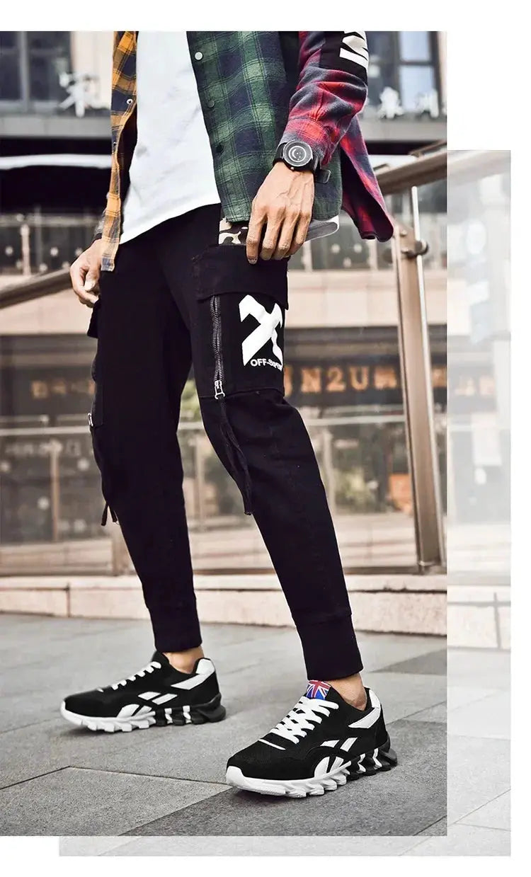 Brand Trend men's fitness sneakers with wear-resistant cushioning, breathable, black with white accents and thick soles.