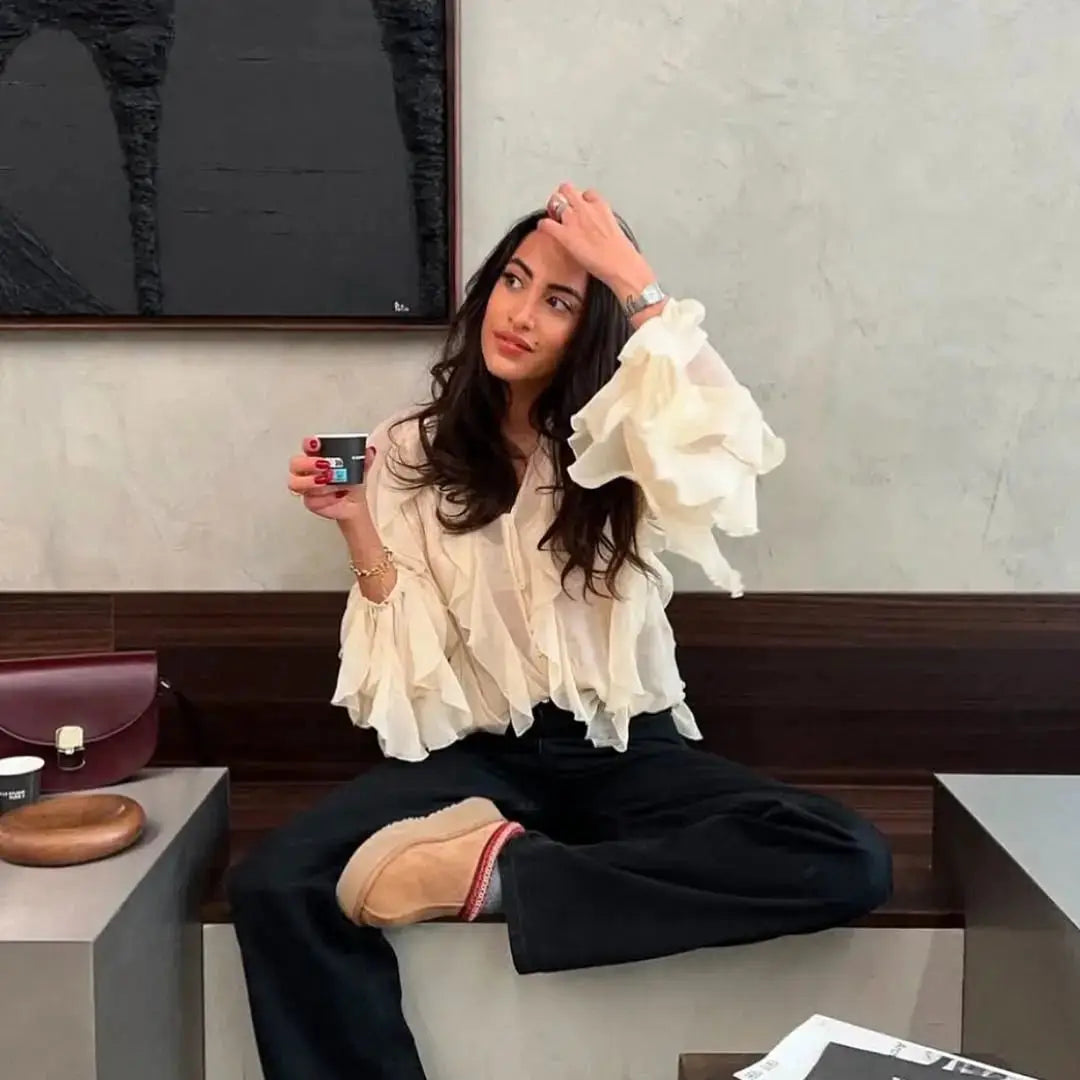 YENKYE semi-sheer ivory ruffle blouse, long sleeves with voluminous ruffles and front-button V-neck.