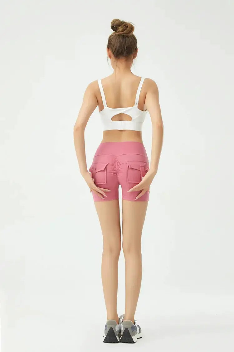 Peach butt fitness shorts for women with cargo back pockets and air-dry fabric, mid-thigh length