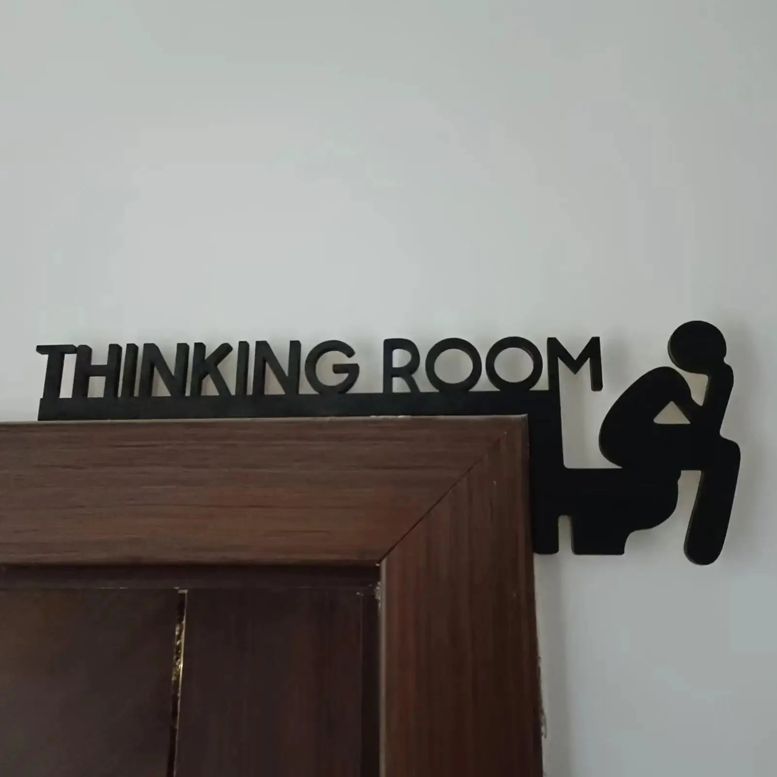 Thinking Room door sign decor in black wood with a thinker silhouette