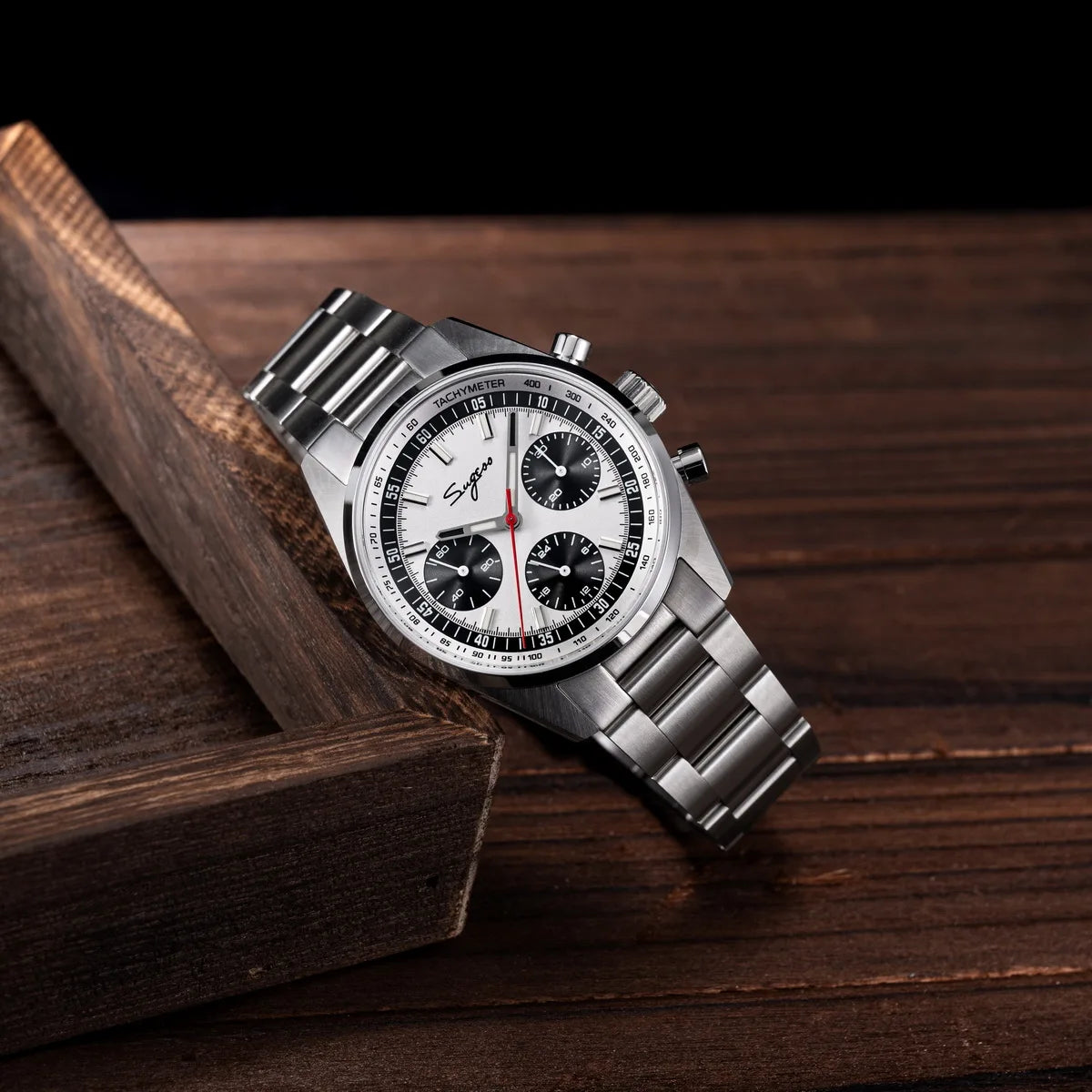 Sugess men's stainless steel chronograph watch with white dial, black subdials, and tachymeter bezel