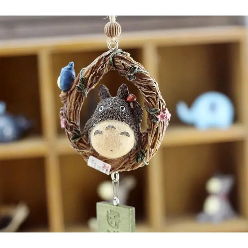 Resin wind chime ornament by Simples Market; round vine wreath with a cute gray character figurine, hanging home decor
