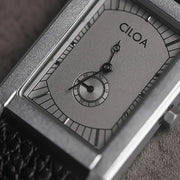 CLOA square men's watch with gray dial, black textured strap, and small seconds subdial.