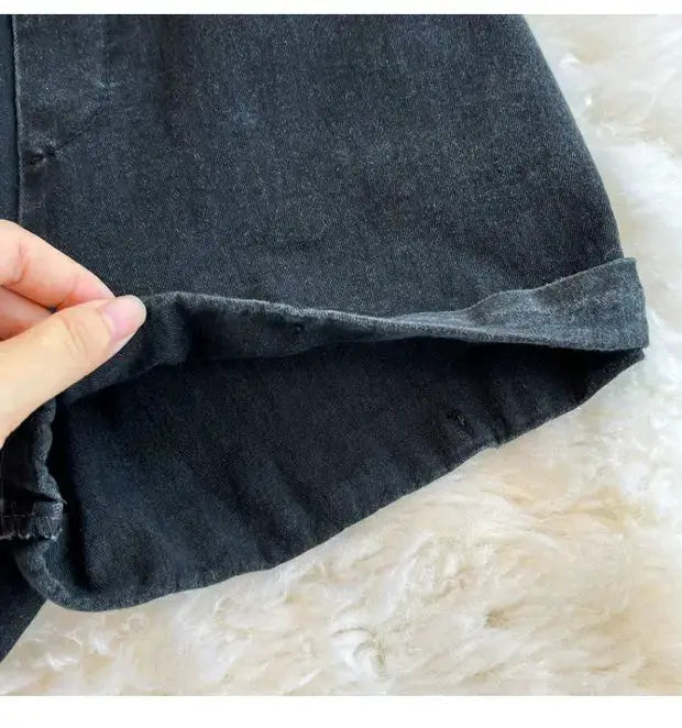 Denim romper jumpsuit for women in dark denim with rolled cuffs