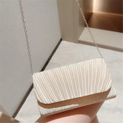 Women's silver pleated evening clutch with chain shoulder strap