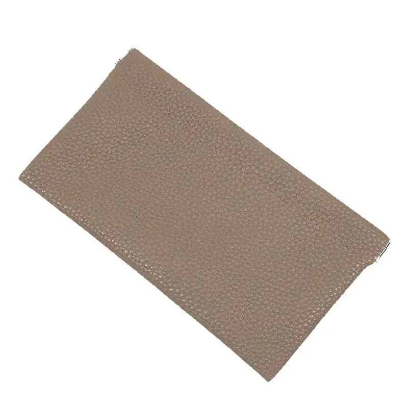 Self-closing artificial leather long wallet by Simples Market in taupe with pebbled texture