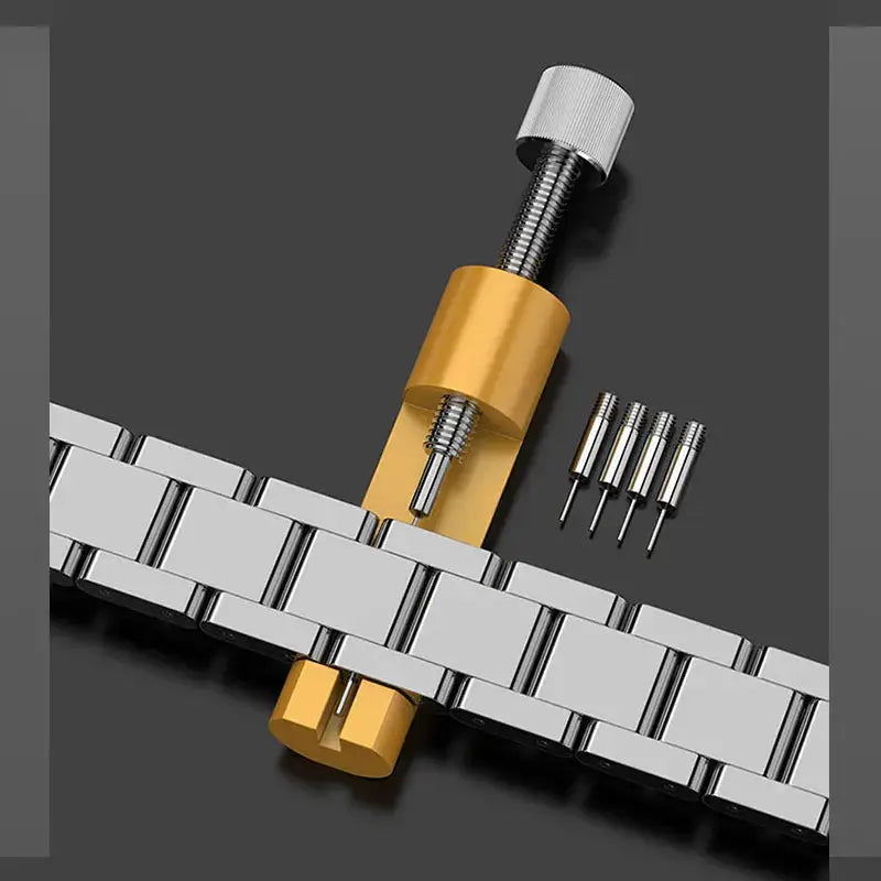 Metal watch repair tool with gold-tone pin remover and five replacement pins for bracelet links