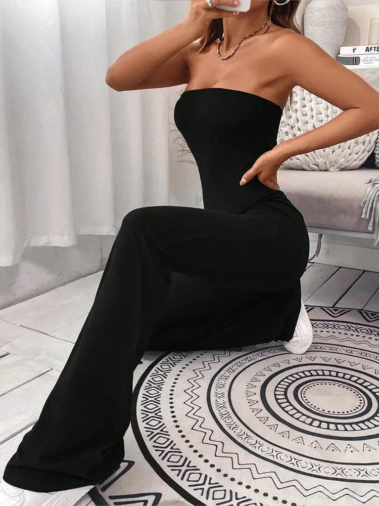 Women's black strapless jumpsuit with a fitted bodice and micro-flare wide legs.