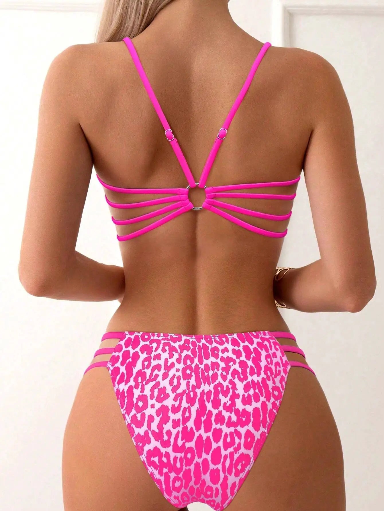 Simples Market pink strappy bikini set with leopard print high-cut bottoms, back view shows multiple straps.